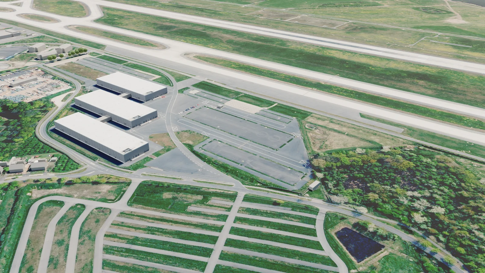 Oblique view from the north-west across the empty Defence Park, halls A to C and the apron