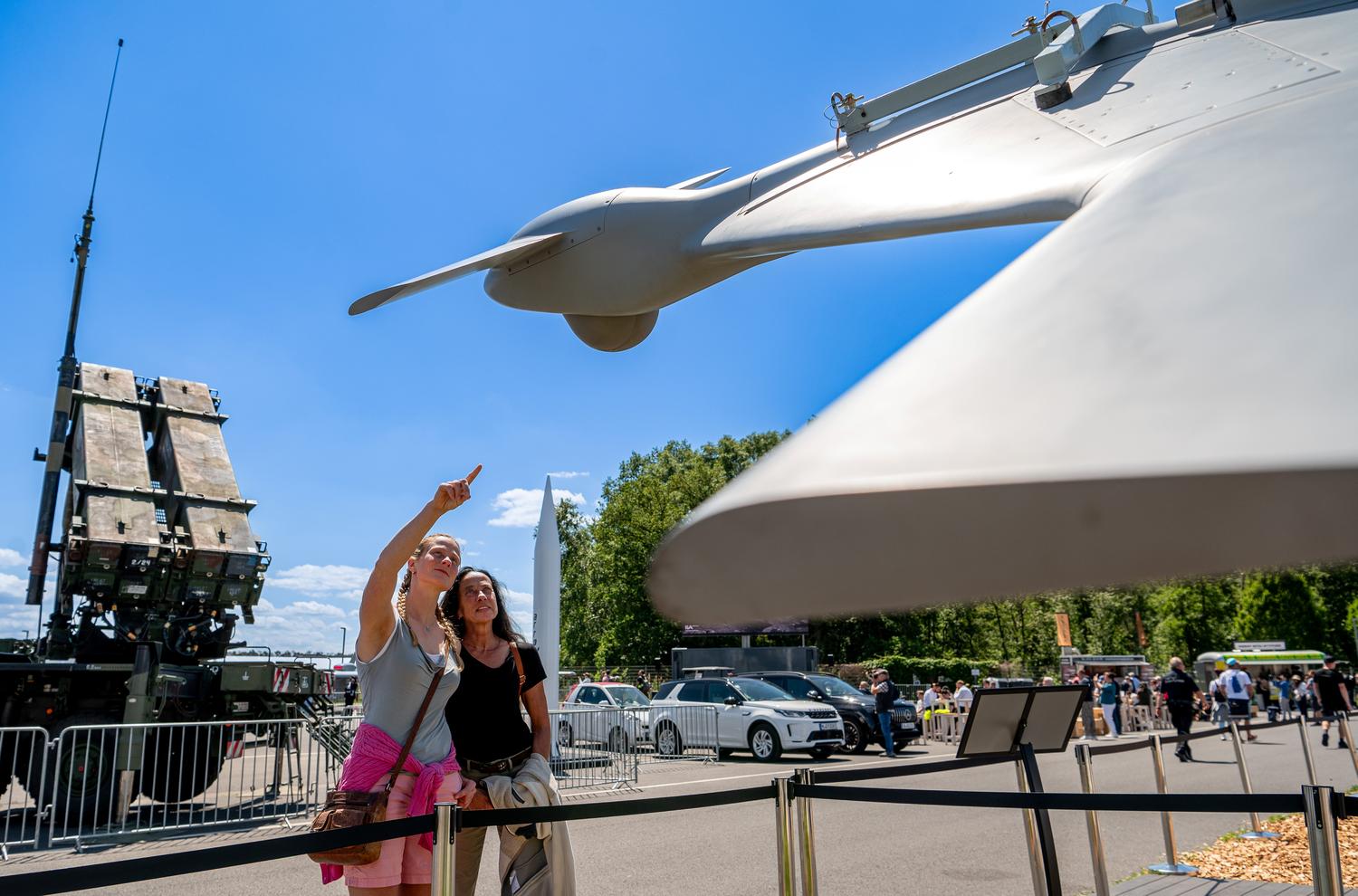 Visitors looking at a drone in the Drone Pavilion